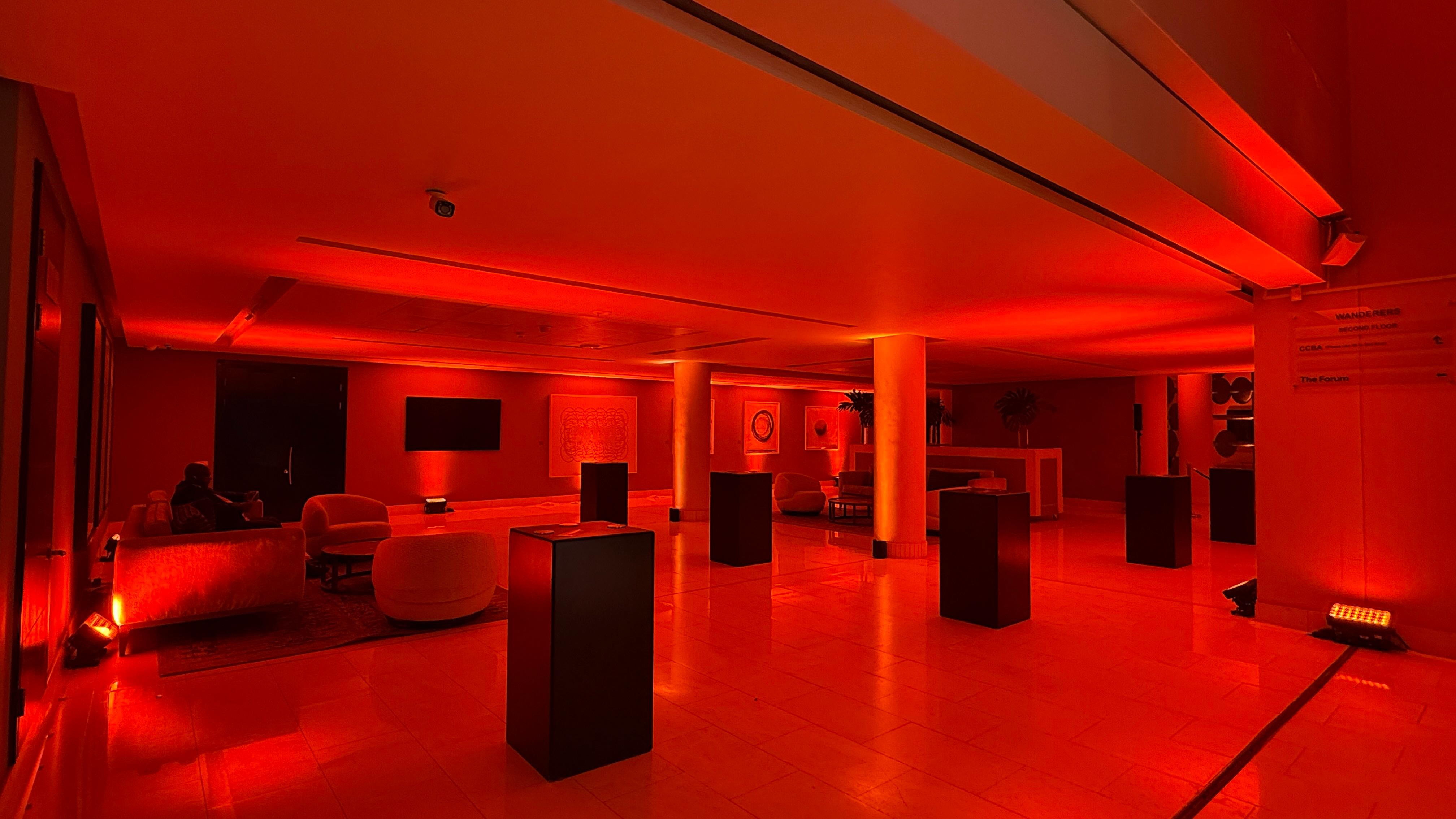Hennessy — lobby and interior brand activation in red wash