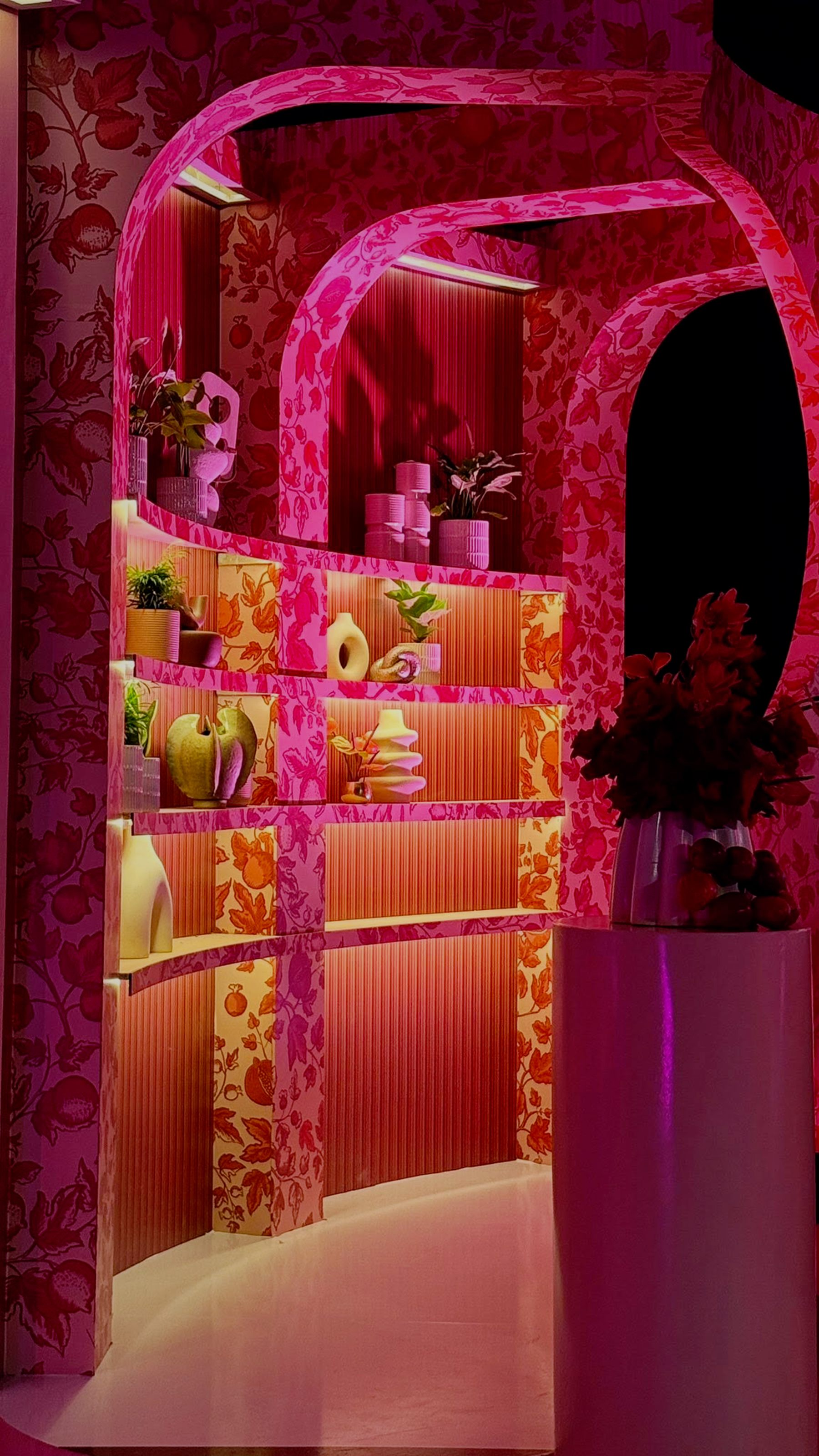 She Owns Her Success — Momentum studio talk-show set with pink floral motif and circular signage