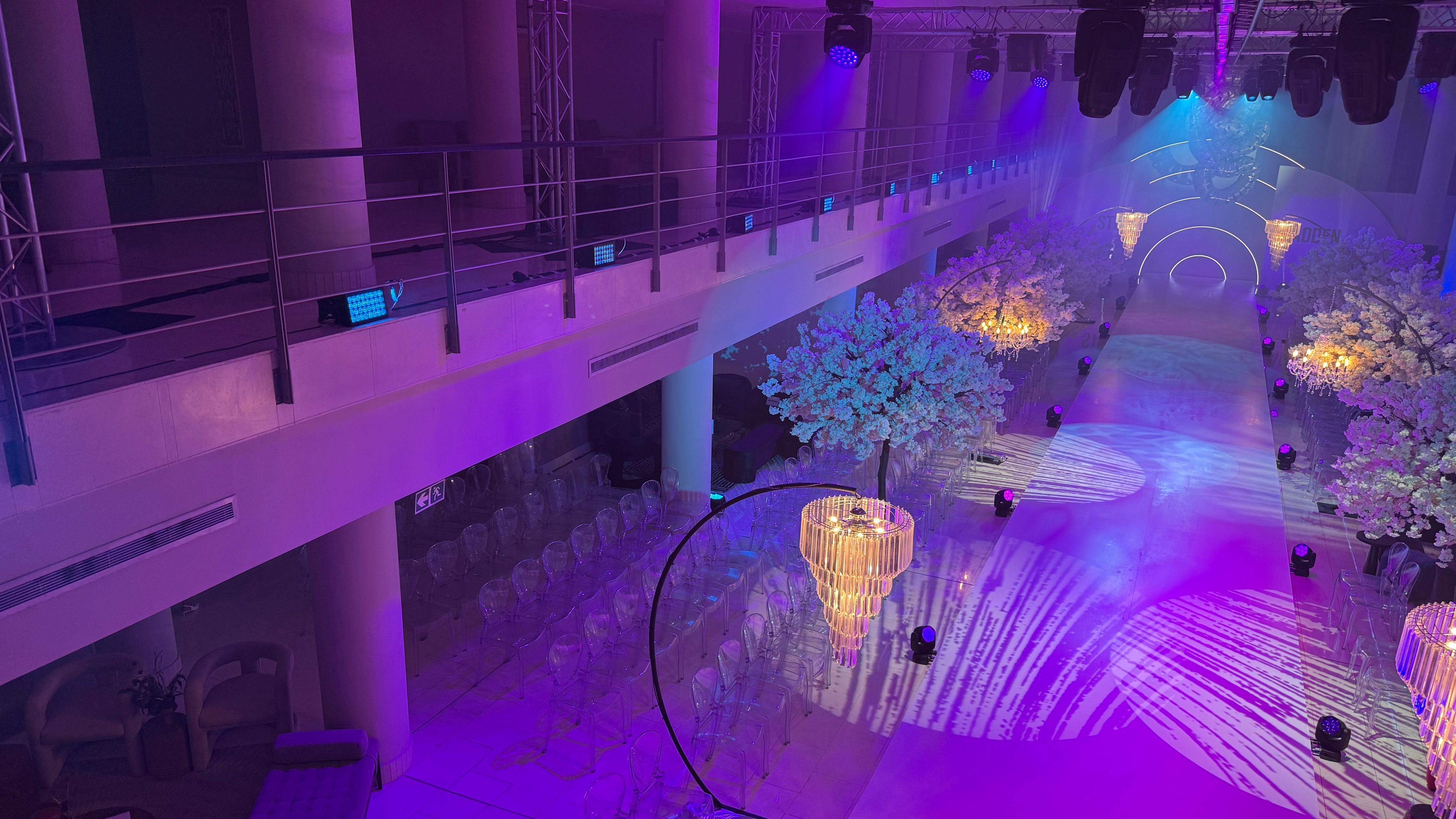 Steve Madden — runway activation with cherry-blossom trees, chandeliers and purple wash